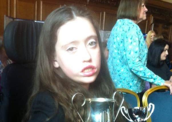 Olivia Bamber pictured with her award at Belfast City Hall. INNT 11-803CON