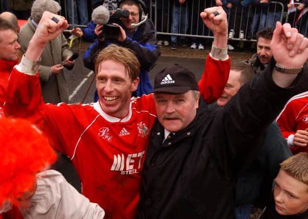 Vinny Arkins and Ronnie McFall celebrate the club's Irish League title triumph in 2002. Pic by Pacemaker Ltd.
