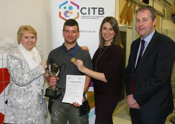 Daniel McBurney from Banbridge who won Gold in Wall and Floor Tiling is pictured with Catherine Bell (DEL), Sarah Travers and Maurice Johnston, Chairman CITB NI