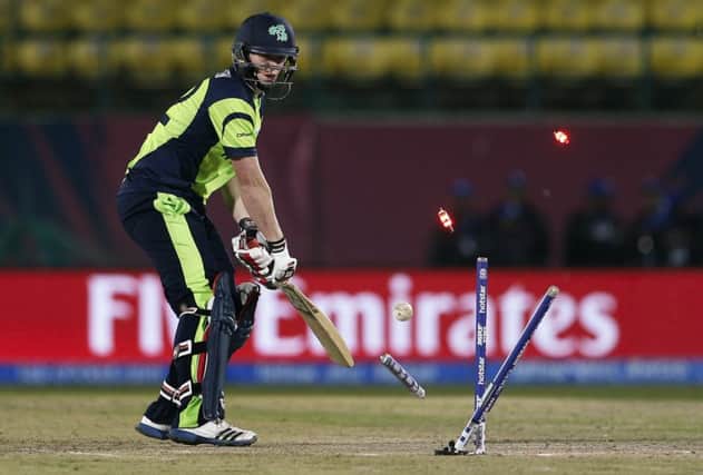 Ireland's Kevin O'Brien is bowled out by Oman's Munis Ansari.