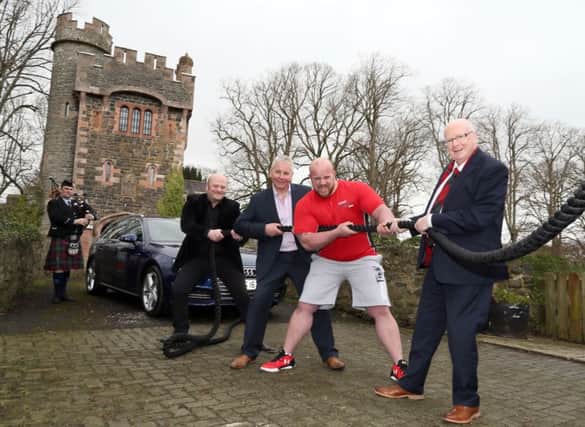 Piper Alistair McCleery from the Ballydonaghy Pipe Band with Andrew Strong, Adrian Morrow (Director of Dalriada Festival), Strongman Chris McNaughton and Alderman Tommy Nicholl from Mid and East Antrim Council.