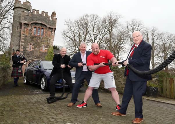 Piper Alistair McCleery from the Ballydonaghy pipe band with Andrew Strong, Adrian Morrow (director of Dalriada Festival), Strong Man Chris McNaughton and Aldermann Tommy Nicholl from Mid and East Antrim Council.  INCT 11-722-CON
