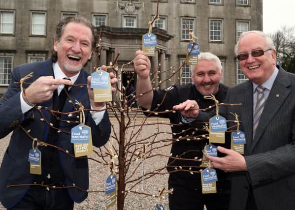 Helping to launch the Food Heartland Awards are, from left, chef Paul Rankin, Simon Dougan from The Yellow Door and Alderman Kenneth Twyble from Armagh City, Banbridge & Craigavon Borough Council. INPT11-037
