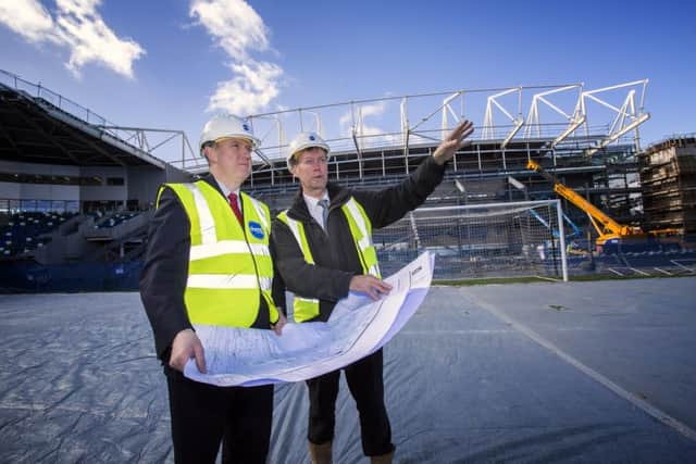 Finance Minister Mervyn Storey pictured as he visited the Â£30million construction site at Windsor Park Stadium.