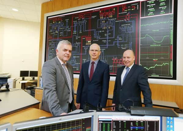 Press Release image

Press Eye - Belfast - Northern Ireland - 9th December 2015

Enterprise, Trade and Investment Minister Jonathan Bell with SONI (System Operator for Northern Ireland) General Manager Robin McCormick and Fintan Slye, Chief Executive of EirGrid Group at the company's Control Centre in Castlereagh.  The Minister visited SONI to discuss plans for the North South electricity Interconnector which he said was "critical for the long term security of supply for Northern Ireland".

Picture by Kelvin Boyes / Press Eye.