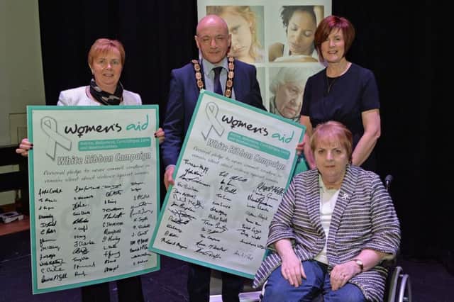 Pictured at the Women's Aid event to mark International Women's Day are Antrim and Newtownabbey Council chief executive Jacqui Dixon, Deputy Mayor John Blair, Rosemary Magill MBE and Cllr Noreen McClelland. INNT 10-0
