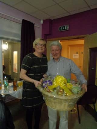 Roma Brown presenting Tommy Liddle, winner of ballot 1st prize, with an Easter Hamper.