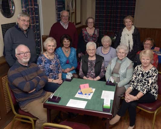 Members of Rathfriland Bridge Club celebrated their 21st Anniversary this year pictured with one of the new Bridge Tables purchased through a Grant from  Armagh City, Banbridge and Craigavon Borough Council Â©Paul Byrne Photography INBL1611-202PB