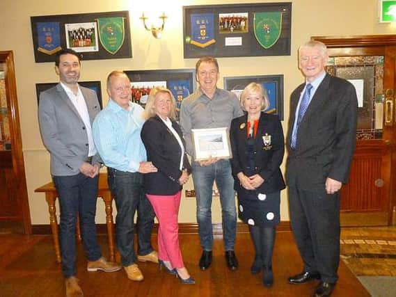 Martin Drain received a presentation from both branches of the club last Saturday evening. L-R: Jason Greenaway (Pro), Paul and Anne Magennis (Captains), Martin Drain, Joy Gowdy and Felix Duffy (Presidents).