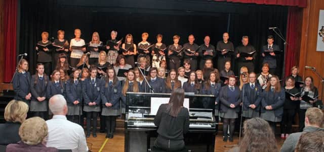 SING OUT. Pictured on stage at an Evening of Music, held at Ballymoney High on Friday night are the Friends of Ballymoney High School Choir led by Mrs Brown.INBM11-16 022SC.