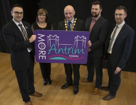 Deputy Mayor of Antrim and Newtownabbey, Councillor John Blair, at the launch of the Antrim Town Card with Antrim town team members Davin Quinn (Specsavers), Kathleen McCurdy (Nanabelle's), Simon Moon (Antrim Towns Development Company) and Gary Toal (Taylor & Toal Opticians).