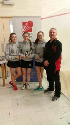 St Patrick's Pupils Emma Lundy (Current Irish Champion), Joanna Donnelly, Katie Peacock with Ulster development officer for squash David Rosenberg.