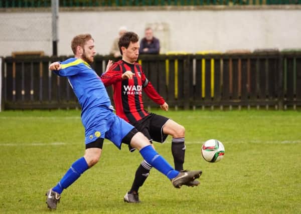 Moyola Park and Banbridge Town compete for the ball