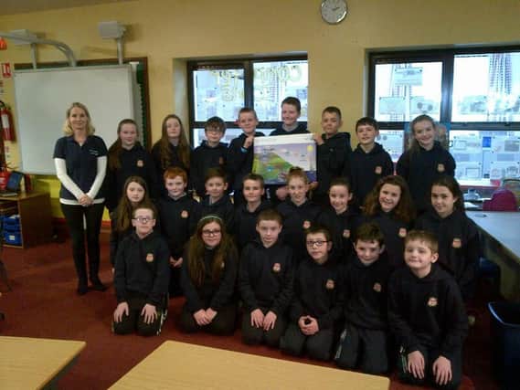 Celine Rodgers of NI Water alongside pupils from Bushvalley Primary School.