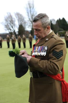 Sergeant Tommy Mateer pinning his Shamrock on