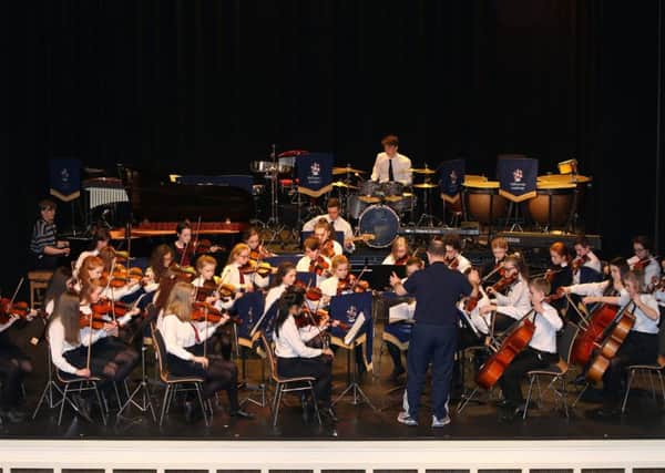 The Junior Strings Orchestra prepare to perform in the Ballymena Academy Spring Concert in the Braid. INBT 12-103JC