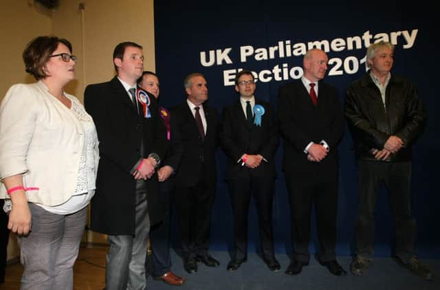 The seven candidates for the Foyle constituency take to the podium at last night's count in Templemore. DER1815MC124