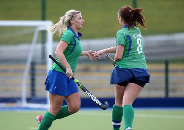 Kirsten Young (left) is congratulated by Clare Gillespie after scoring a goal during Saturday's league game with Ballyclare at the Academy. INBT 12-201CS