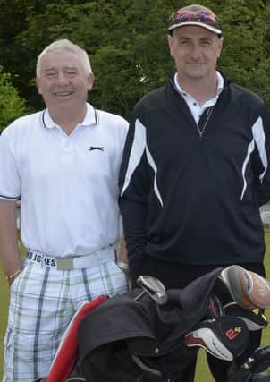 Philip McCourt (left), who shot a nett 59, along with Jim Gracey. INBL1425-277EB
