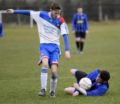 BBOB Reserves forward Glen Downey takes a tumble after a tackle from Lincoln Courts Reserves player George Forrest. INLS1216-141KM
