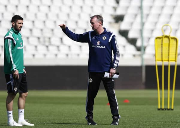 Northern Ireland manager Michael O'Neill pictured talking to Daniel Lafferty. Picture by William Cherry/Presseye