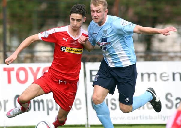 Jay Donnelly, pictured here in action against Ballymena United's Johnny Taylor earlier this season, is one of three Cliftonville players to receive international cal-ups, leading to this Saturday's game at the Showgrounds being postponed.
