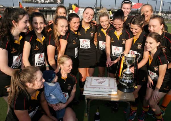 Lurgan Ladies cut a special cake to mark them winning the Ulster Premier League. INLM12-647AM