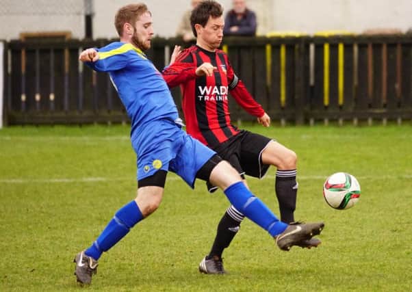 Moyola Park and Banbridge Town compete for the ball