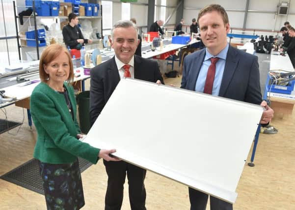 Enterprise, Trade and Investment Minister Jonathan Bell has announced a Â£4m investment and 93 new manufacturing jobs at Bloc Blinds in Magherafelt. Supported by Invest Northern Ireland and First Trust Bank, Bloc Blinds' investment includes new manufacturing facilities and extensive market development activities to help drive export sales. Pictured are Edel McCooe, Regional Director First Trust Bank, Minister Bell and Cormac Diamond, Managing Director Bloc Blinds.
Photo by Simon Graham/Harrison Photography