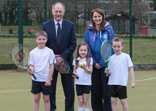 Mossley Primary principal Stephen Mulligan, teacher Laura Boyd and pupils Adam Hewitt, Holly Logan and Shane Kernaghan are hoping the school will get the go-ahead for a new Â£175,000 tennis facility development. INNT 11-500-SO Pic by Shirley O'Neill