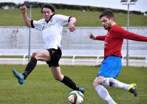 Action between Lisburn Distillery and Ards US0916-414PM Pic by Paul Murphy