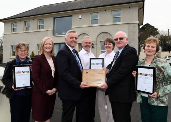 T  Minister Jonathan Bell Department of Enterprise Trade and Investment, presents Councillor Billy Ashe ,Lord Mayor Mid and East Antrim Borough council, with the World Host Village status plaque for Glenarm,outside Watersedge B&B in Glenarm. Included are (LR) Glenarm Building  Trustees of Glenarm Buildings Preservation Trust Penny McBride,Aine Kearney,Tourism NI Director of Business Development  and events,Peter and Jenny  Monroe, Watersedge B&B, and Maureen McAuley, Glenarm Buildings Preservation Trust. (Contributed pic)