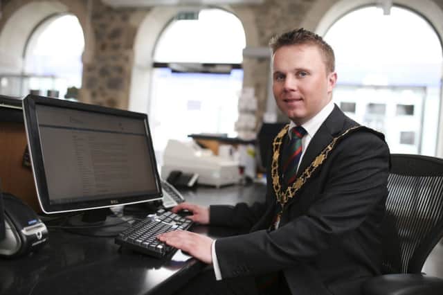 The Mayor of Antrim and Newtownabbey, Councillor Thomas Hogg, reviewing the online questionnaire.
