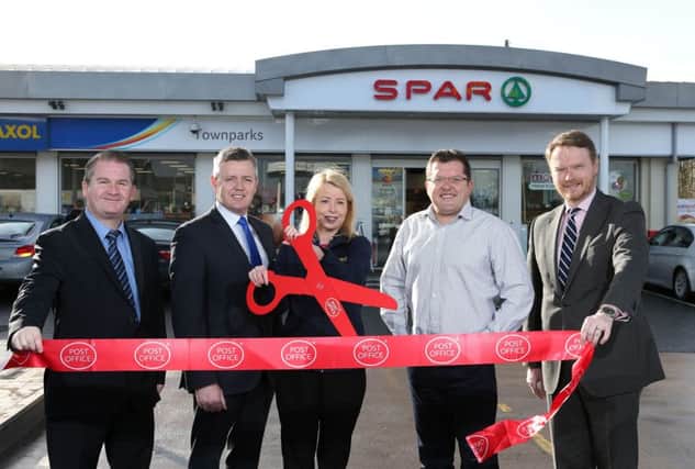 Pictured at the Townparks Maxol Station on the Ballymena Road in Antrim are Mark Gibson, Public Affairs Manager of The Post Office, local UUP Councillor Paul Michael, licensees of the station Rhonda and Charles Henderson and Kevin Paterson, Maxol NI Retail Manager, announcing the opening of a new Post Office at the station.  Picture: Matt Mackey/Press Eye