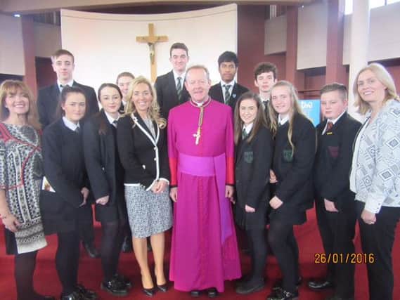 Pupils of Drumcree College pictured in January at Catholic Schools Week. Included is principal Noella Murray, centre, with Archbishop of Armagh Eamon Martin. INPT12-010