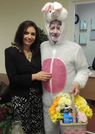 The Easter Bunny (aka Tommy McCallion) gets a photo taken with the Mayor, Councillor Elisha McCallion during Thursday's Shantallow Senior Citizens Easter Lunch at the Community Centre. DER1315MC121