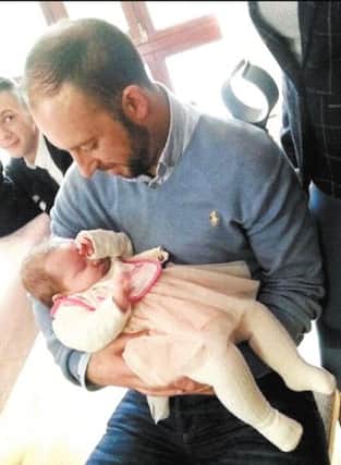 Buncrana hero Davitt Walsh holds baby Rioghnach-Ann after meeting her and mum Louise this weet. Davitt rescued the baby girl from her fathers sinking car in Buncrana harbour last Sunday evening.