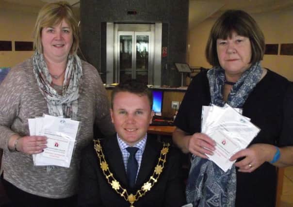 Mayor Thomas Hogg launching the 'Newtownabbey Secured' initiative with Councillor Linda Clarke (Chair of Antrim and Newtownabbey PCSP) and Valerie Adams (Vice Chair of Antrim and Newtownabbey PCSP). INNT 13-506CON