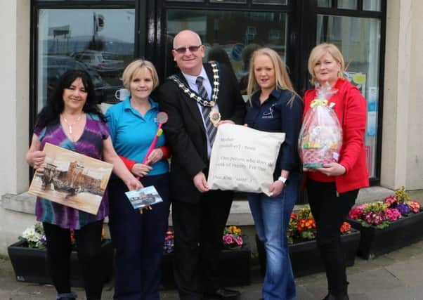 Mayor Cllr Billy Ashe pictured with participants from the Carrickfergus Pop Up Shop, June McKenzie (Afrecca Arts), Leigh Hunter (Growing Smiles), Sarah King (Stitched), Elaine McIvor (Murphys Barkery).  INCT 13-725-CON