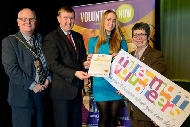 Milena Mroz, a volunteer with  Ballymoney Community Rescource Centre receives her MV award of excellence from the  Mayor of Mid & East Antrim Borough Council, Councillor Billy Ashe, Minister Mervyn Storey MLA and  Wendy Osborne CEO, Volunteer Now. INBM14-16S