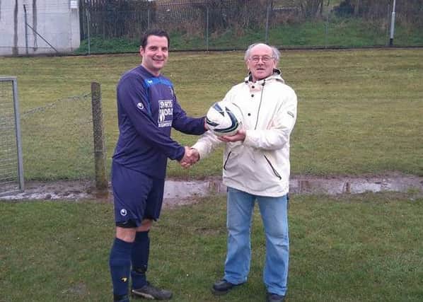 Cookstown RBL Captain Gary Donaldson receiving the match ball from Rab on behalf of DBS Building Supplies who sponsored the team's match at the weekend. Thanks from all at Cookstown RBL.