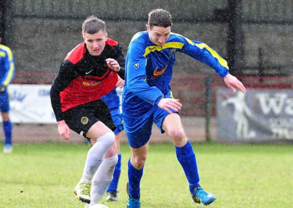 Moyola Park's Adam Gray gets away from Tobermore Utd's Niall Murray during Saturday's derby clash at Fortwilliam Park.INMM1316-325