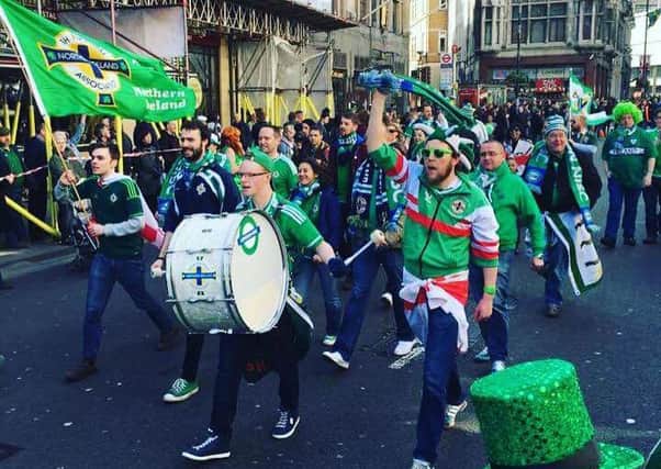 Craig Lutton (with drum) leading the London Northern Ireland Supporters' Club through London as they took part in the recent St. Patrick's Day Parade.