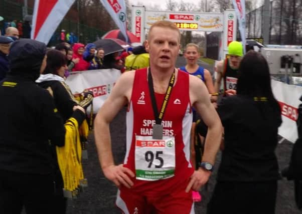 Pierce McCullagh with his medal at the Omagh Half Marathon 2016