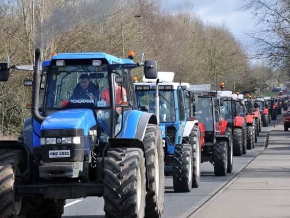 On the road for the 2016 Moneymore Y.F.C Easter Monday Tractor Run in aid of the Northern Ireland Children's Hospice.INMM1316-355