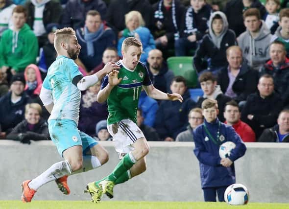 Northern Ireland's Shane Ferguson gets away from Slovenia's Skubic Nejc. Picture by Jonathan Porter/PressEye