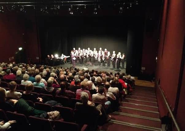 Audience gathered for a performance in the auditorium at the Waterside Theatre.