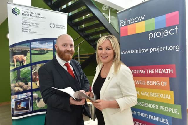 Agricultural and Rural Development Minister Michelle ONeill reads over new research into the experiences of LGB&/T people living in rural areas with Rainbow Project Director John O'Doherty. Photo Sion Graham/Harrison Photography