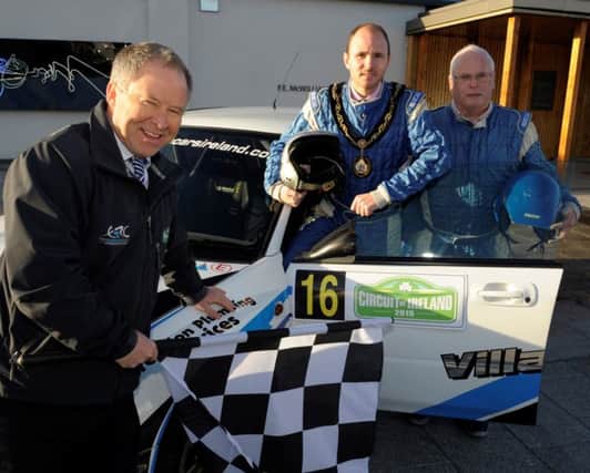 Lord Mayor of Armagh City, Banbridge and Craigavon, Cllr Darryn Causby (2nd, right) helps launch the Circuit of Ireland Rally in Banbridge with Event Director, Bobby Willis (left) and local rally driver Kenny McKinstry (right).