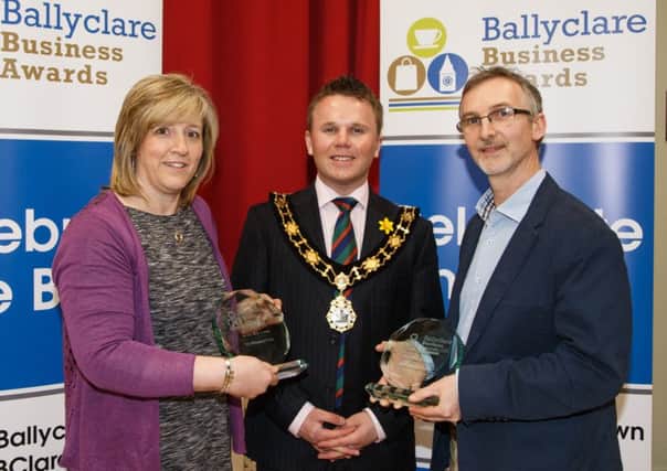 Mayor Thomas Hogg congratulates Rosemary and Mark Davis from Pots of Pleasure on their success at the Ballyclare Business Awards. INNT 14-500CON